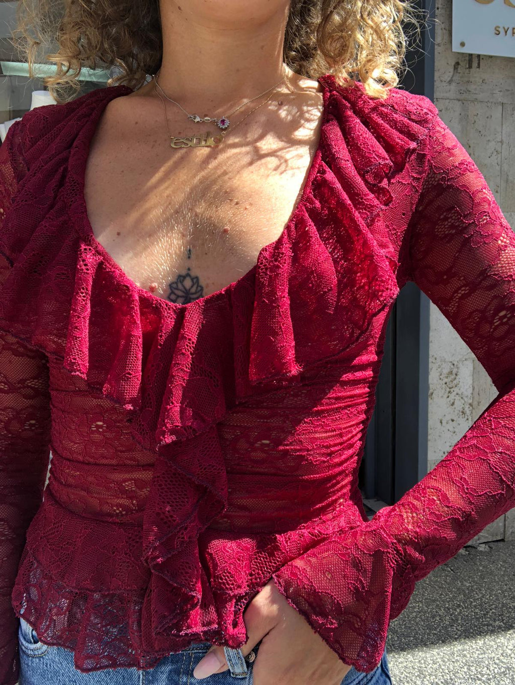 Blusa in pizzo con volant