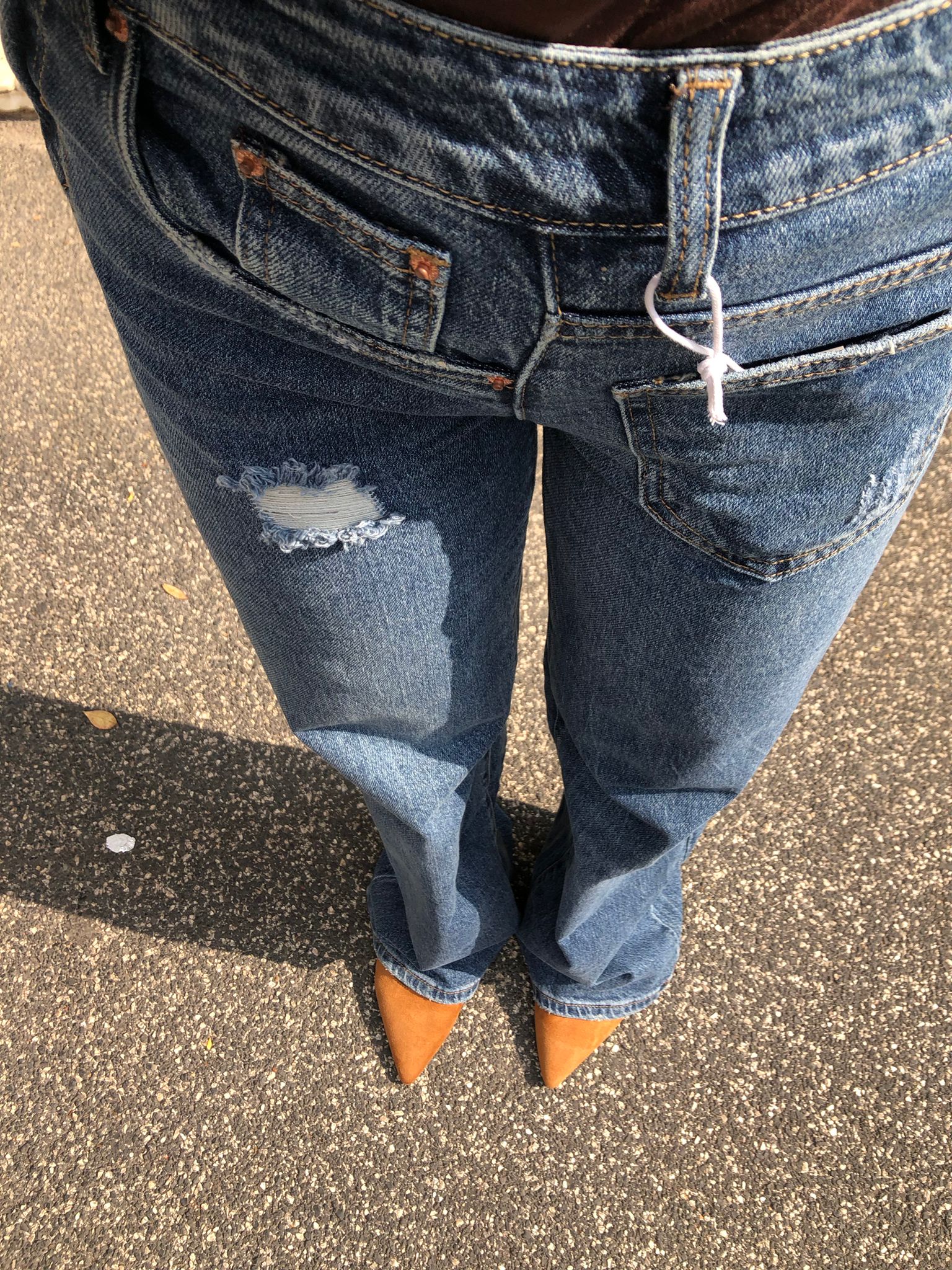 Jeans con abbottonatura laterale