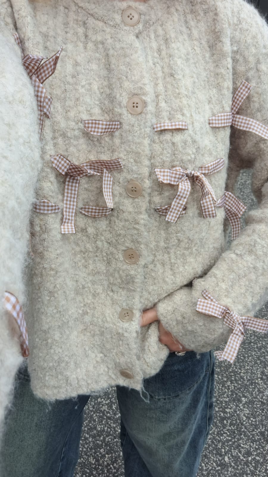 Cardigan teddy con fiocchi